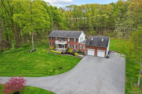 front view of a house with a backyard