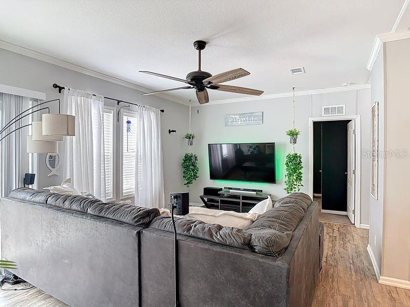 102 Ash Street Edgewater, FL 32141 - Photo 15 of 36 a living room with furniture and a flat screen tv