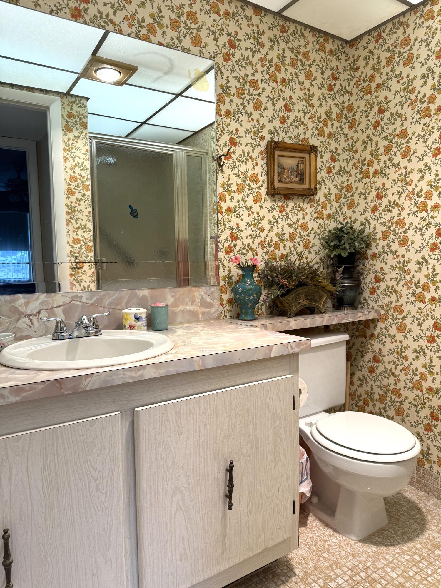 894 Flanders South Delray Beach, FL 33484 - Photo 11 of 16 a bathroom with a granite countertop toilet sink and mirror