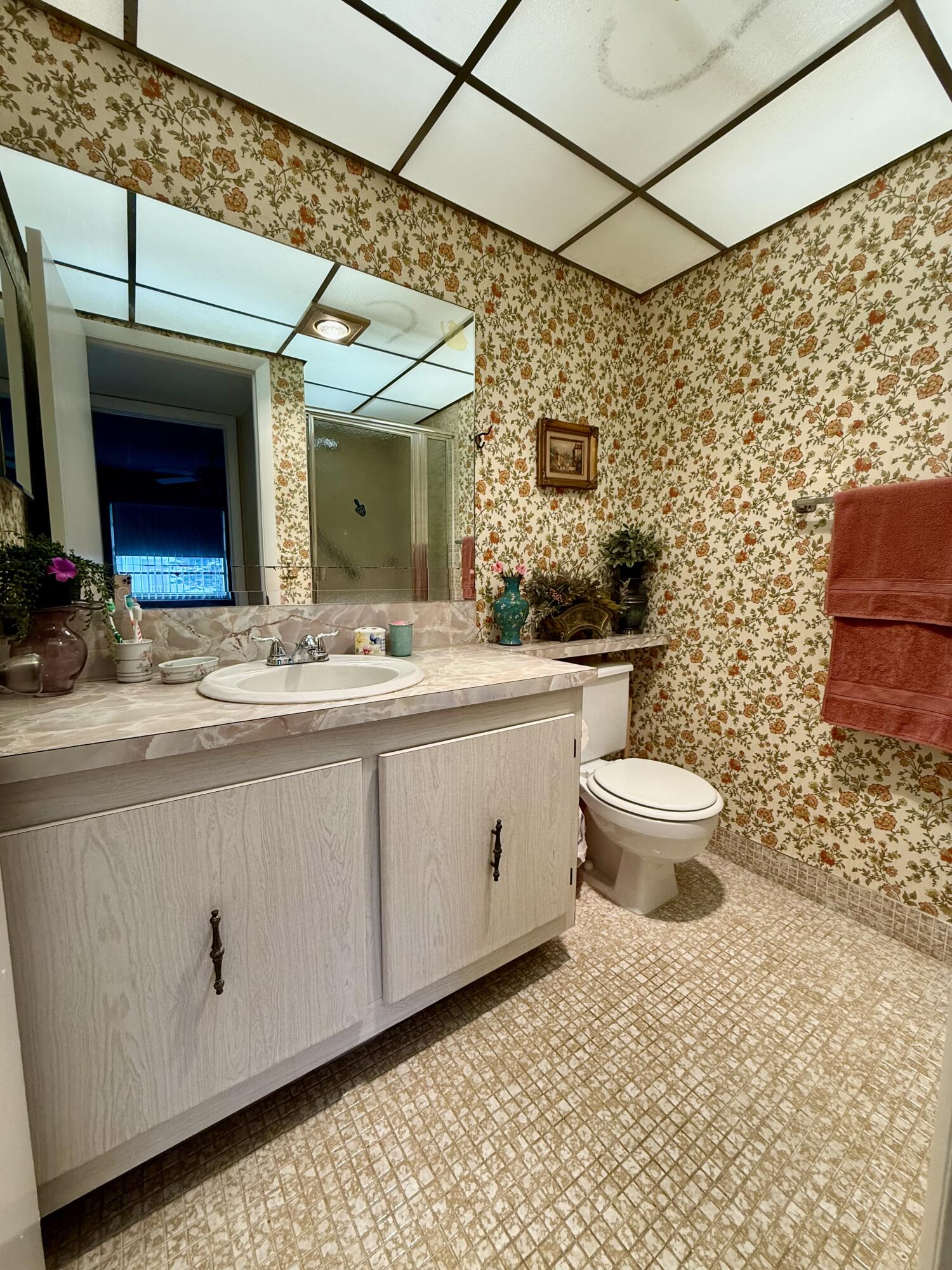 894 Flanders South Delray Beach, FL 33484 - Photo 12 of 16 a bathroom with a sink a toilet and mirror
