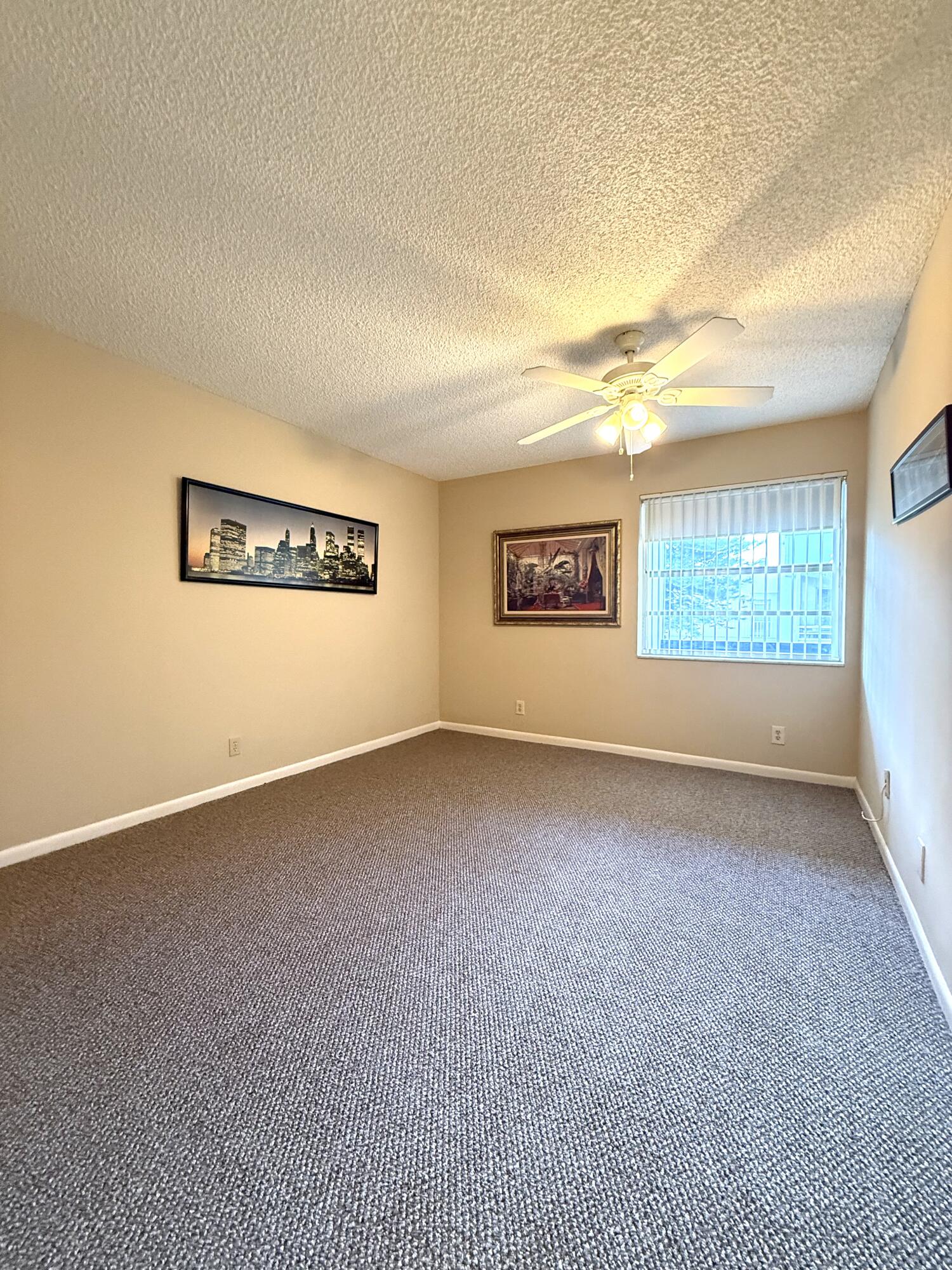 894 Flanders South Delray Beach, FL 33484 - Photo 13 of 21 a view of an empty room with a window