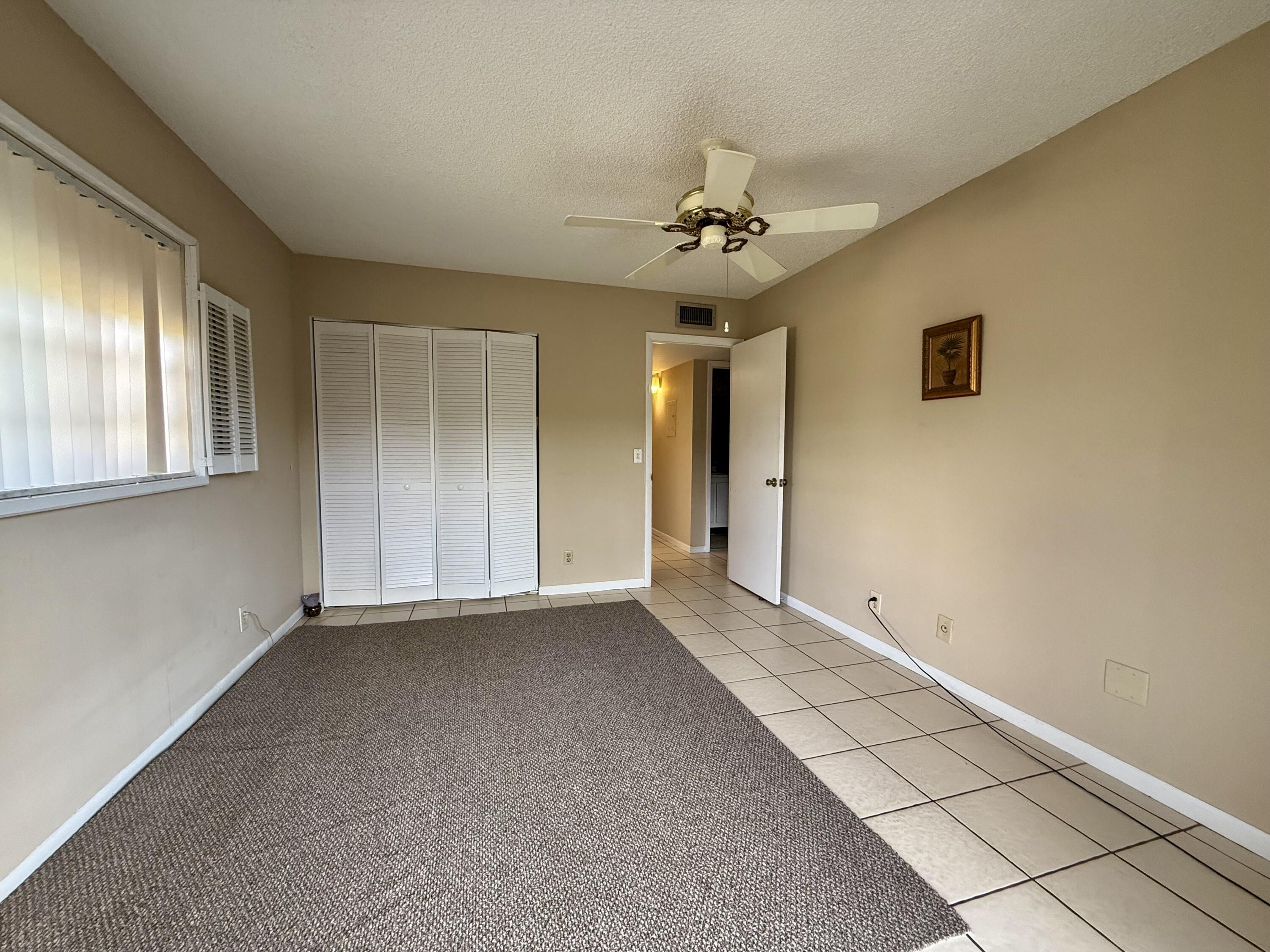 894 Flanders South Delray Beach, FL 33484 - Photo 18 of 21 a view of an empty room with a window