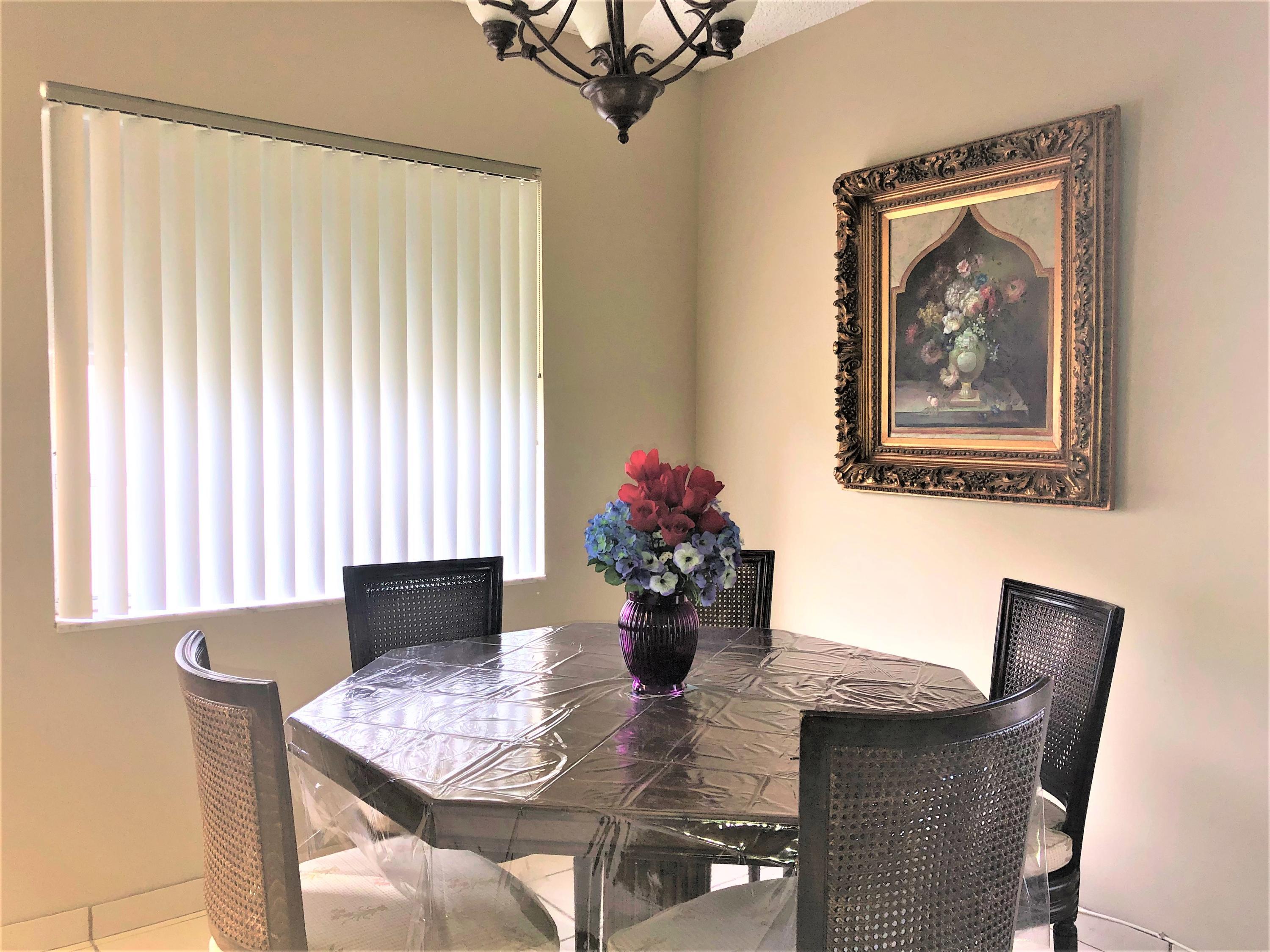 894 Flanders South Delray Beach, FL 33484 - Photo 3 of 16 a dining room with furniture and window