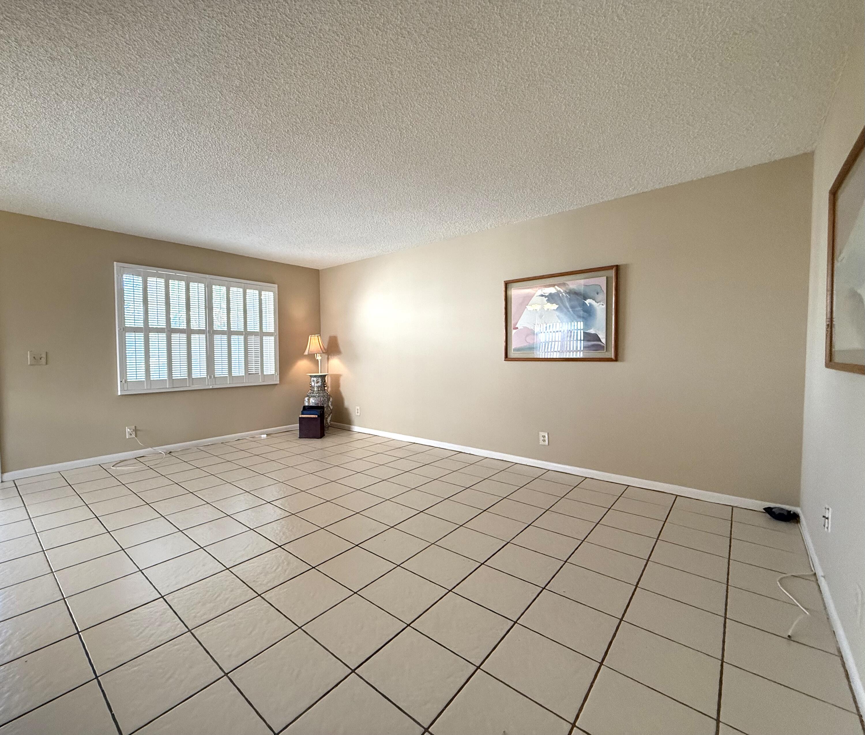 894 Flanders South Delray Beach, FL 33484 - Photo 7 of 21 a bedroom with a bed and a window