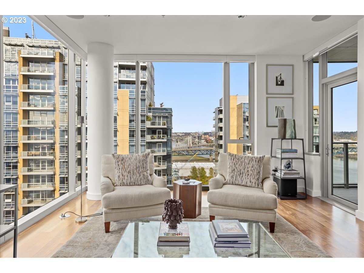 841 Southwest Gaines Street, Unit 1800 Portland, OR 97239 - Photo 13 of 39 a living room with furniture and a large window