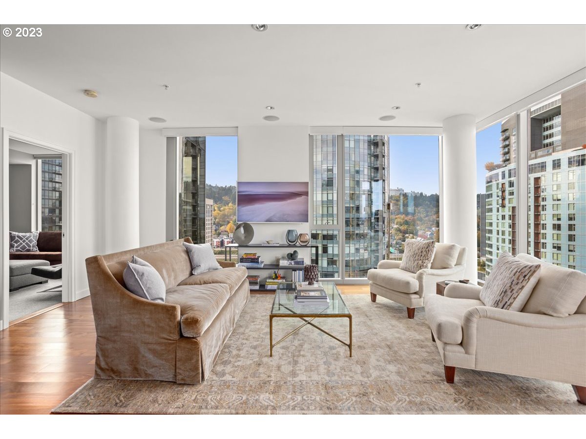 841 Southwest Gaines Street, Unit 1800 Portland, OR 97239 - Photo 14 of 39 a living room with furniture and large windows