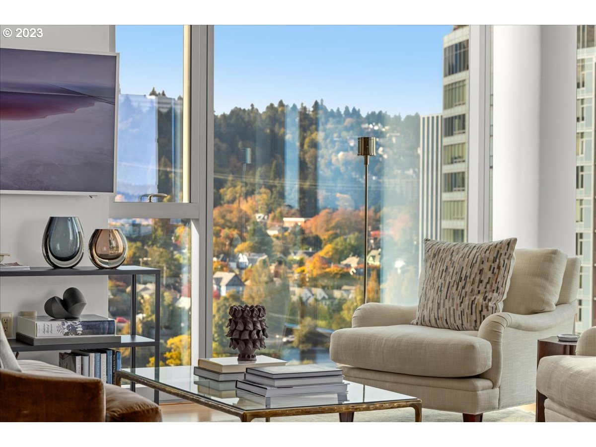 841 Southwest Gaines Street, Unit 1800 Portland, OR 97239 - Photo 15 of 39 a living room with furniture and a floor to ceiling window