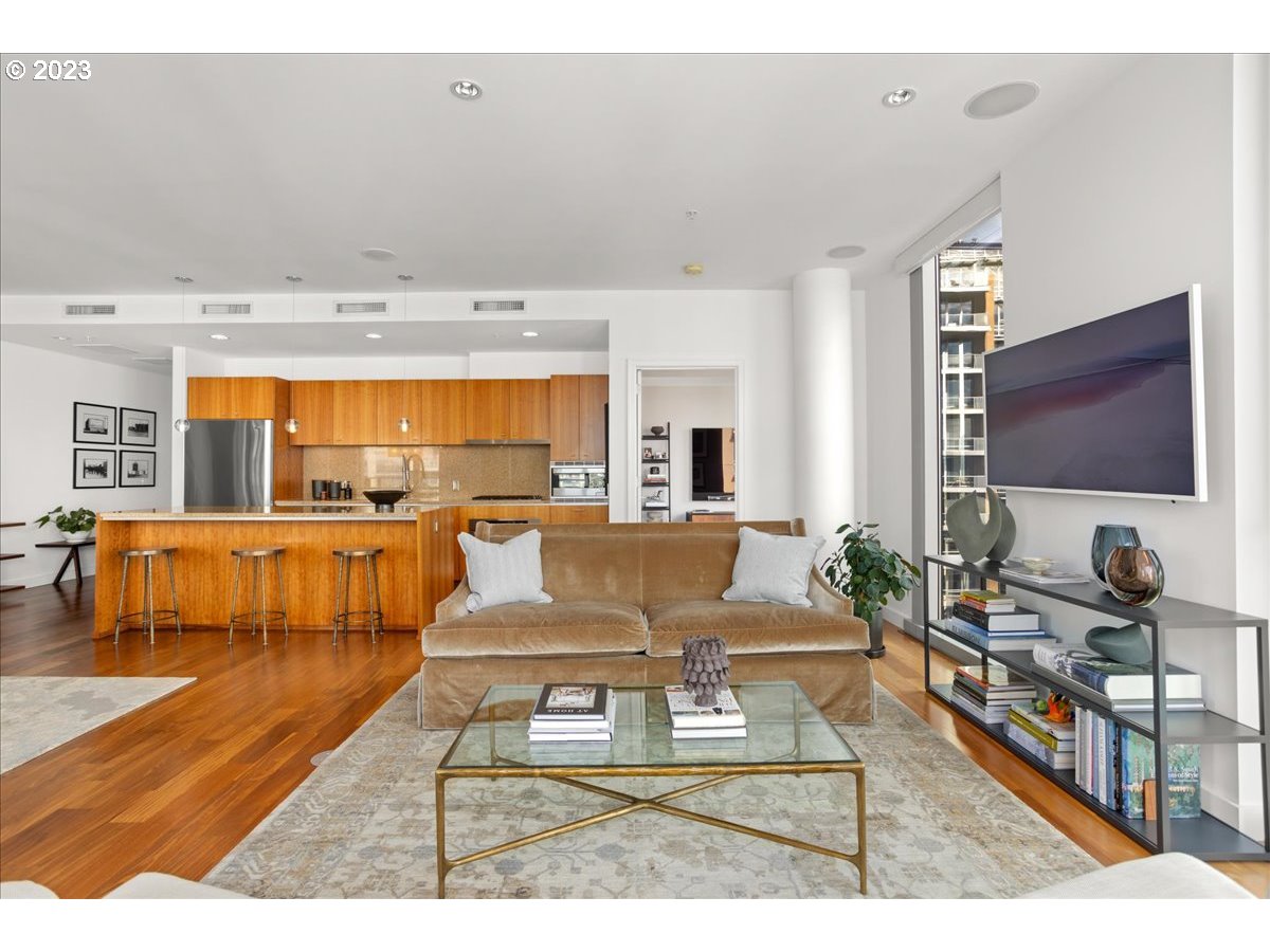841 Southwest Gaines Street, Unit 1800 Portland, OR 97239 - Photo 16 of 39 a living room with furniture and a flat screen tv