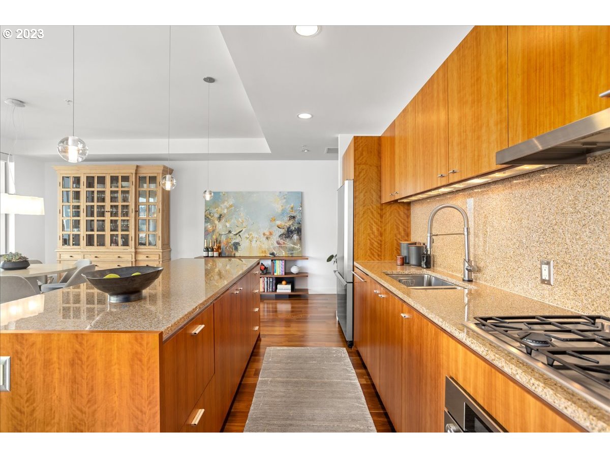 841 Southwest Gaines Street, Unit 1800 Portland, OR 97239 - Photo 18 of 39 a kitchen with sink stove and cabinets