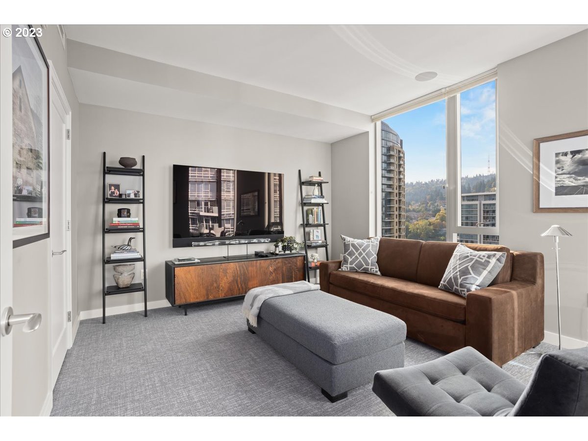 841 Southwest Gaines Street, Unit 1800 Portland, OR 97239 - Photo 29 of 39 a living room with furniture and a large window