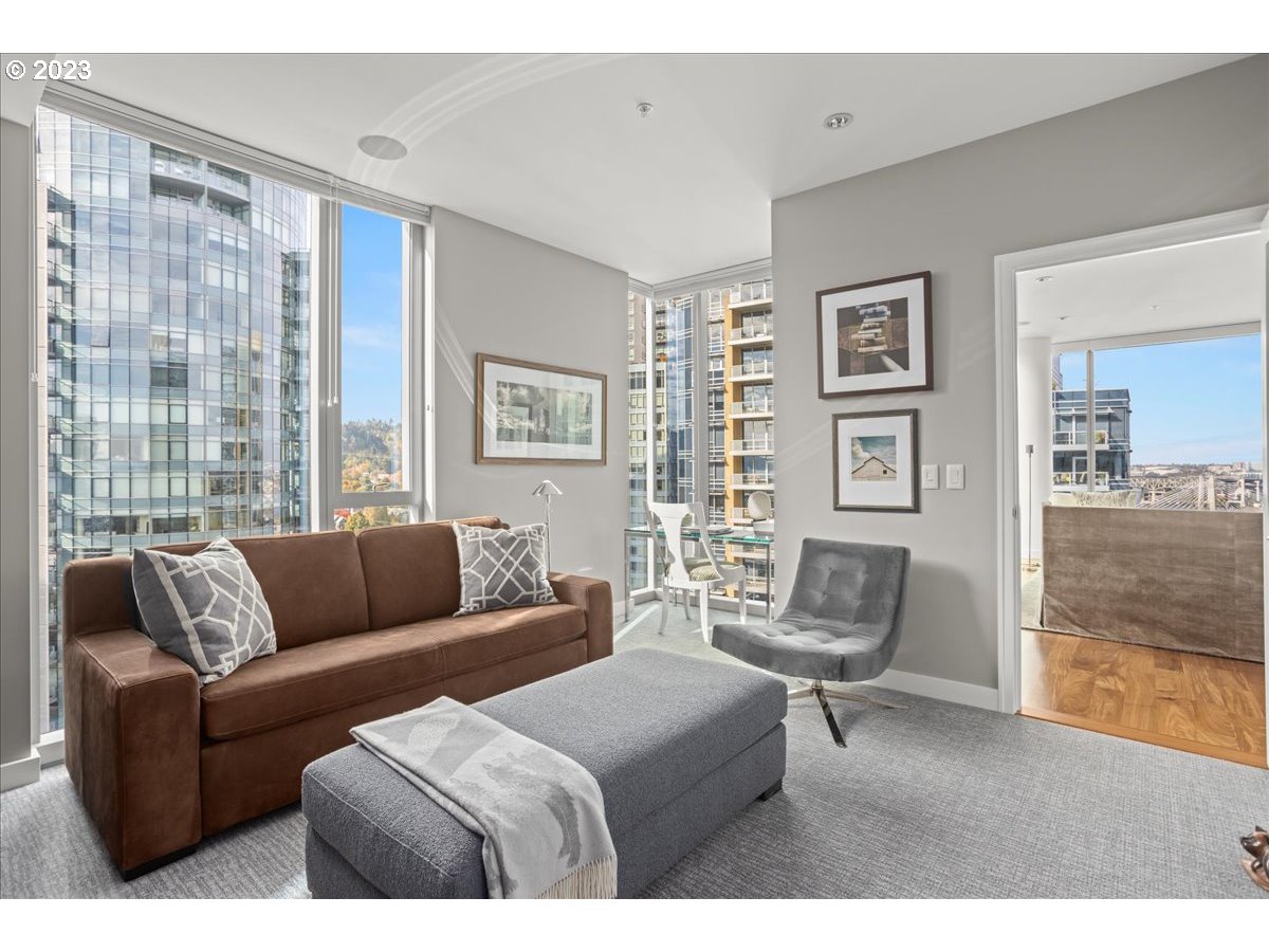 841 Southwest Gaines Street, Unit 1800 Portland, OR 97239 - Photo 30 of 39 a living room with furniture and a large window