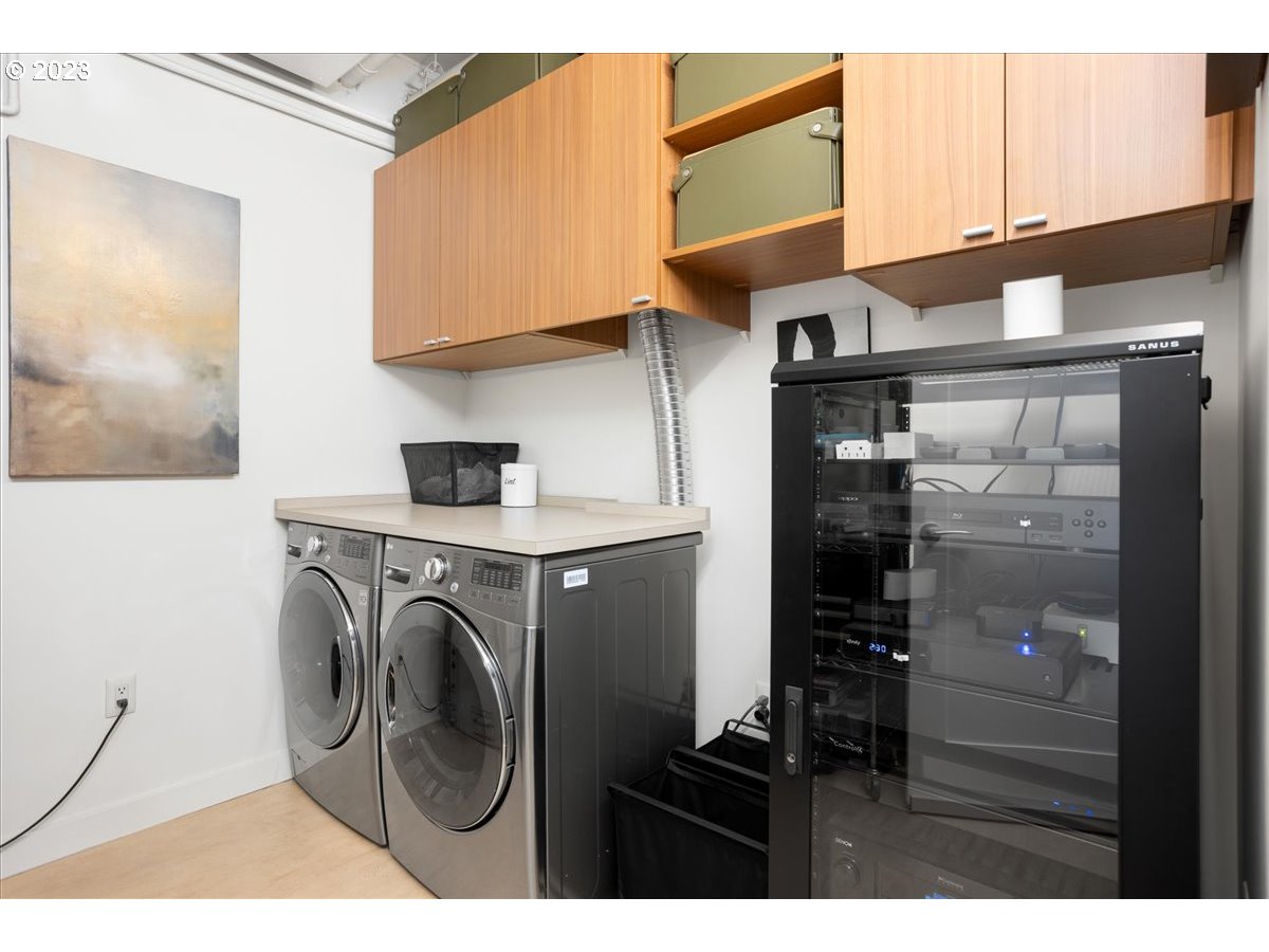 841 Southwest Gaines Street, Unit 1800 Portland, OR 97239 - Photo 33 of 39 a utility room with dryer and washer