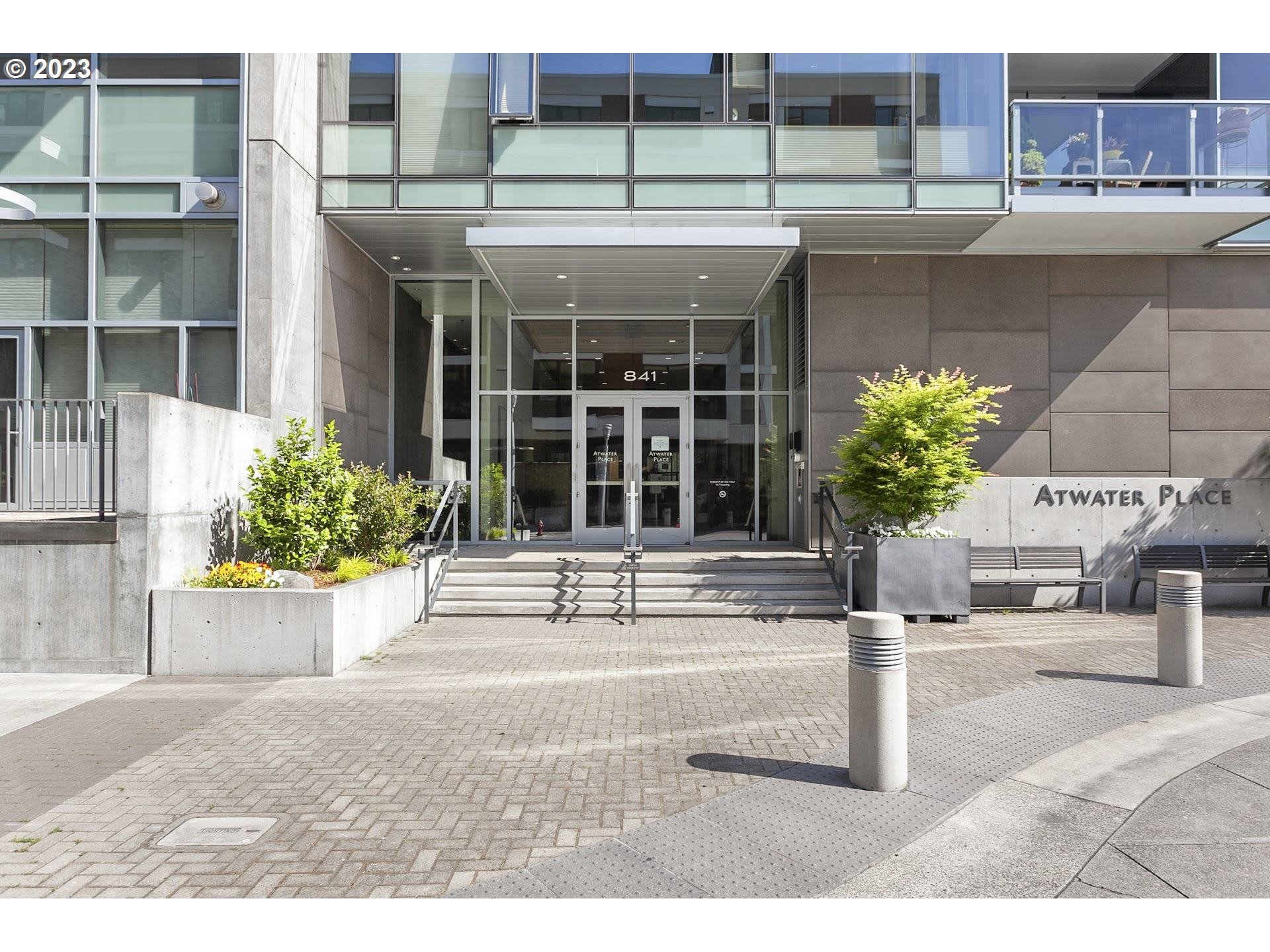 841 Southwest Gaines Street, Unit 1800 Portland, OR 97239 - Photo 35 of 39 a view of a house with potted plants