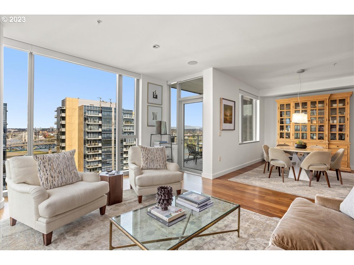 841 Southwest Gaines Street, Unit 1800 Portland, OR 97239 - Photo 4 of 39 a living room with furniture and a large window