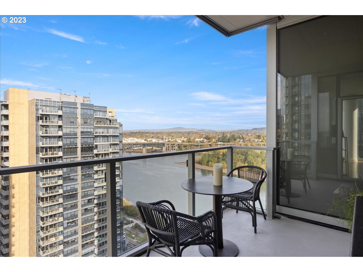 841 Southwest Gaines Street, Unit 1800 Portland, OR 97239 - Photo 5 of 39 a view of a balcony with chairs