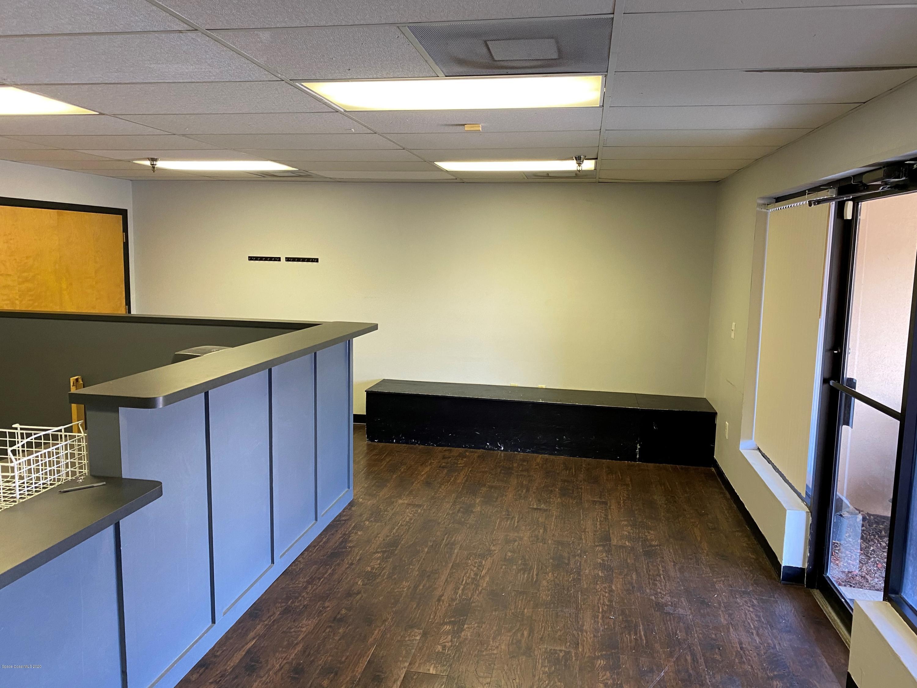282 North Wickham Road Melbourne, FL 32935 - Photo 2 of 7 Lobby Showroom Reception 1