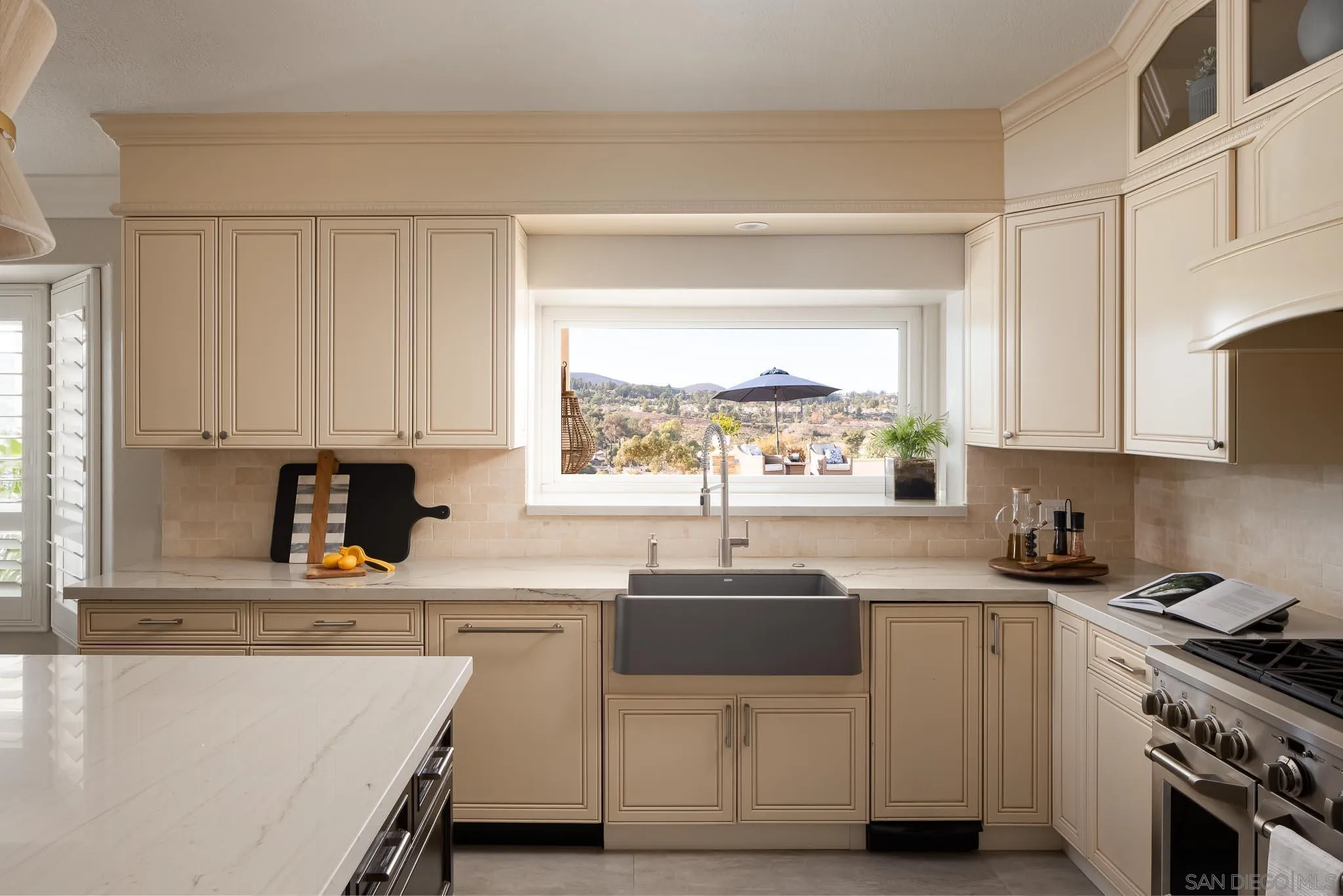 12645 Treehill Place Poway, CA 92064 - Photo 13 of 52 a kitchen with cabinets appliances a sink and a window