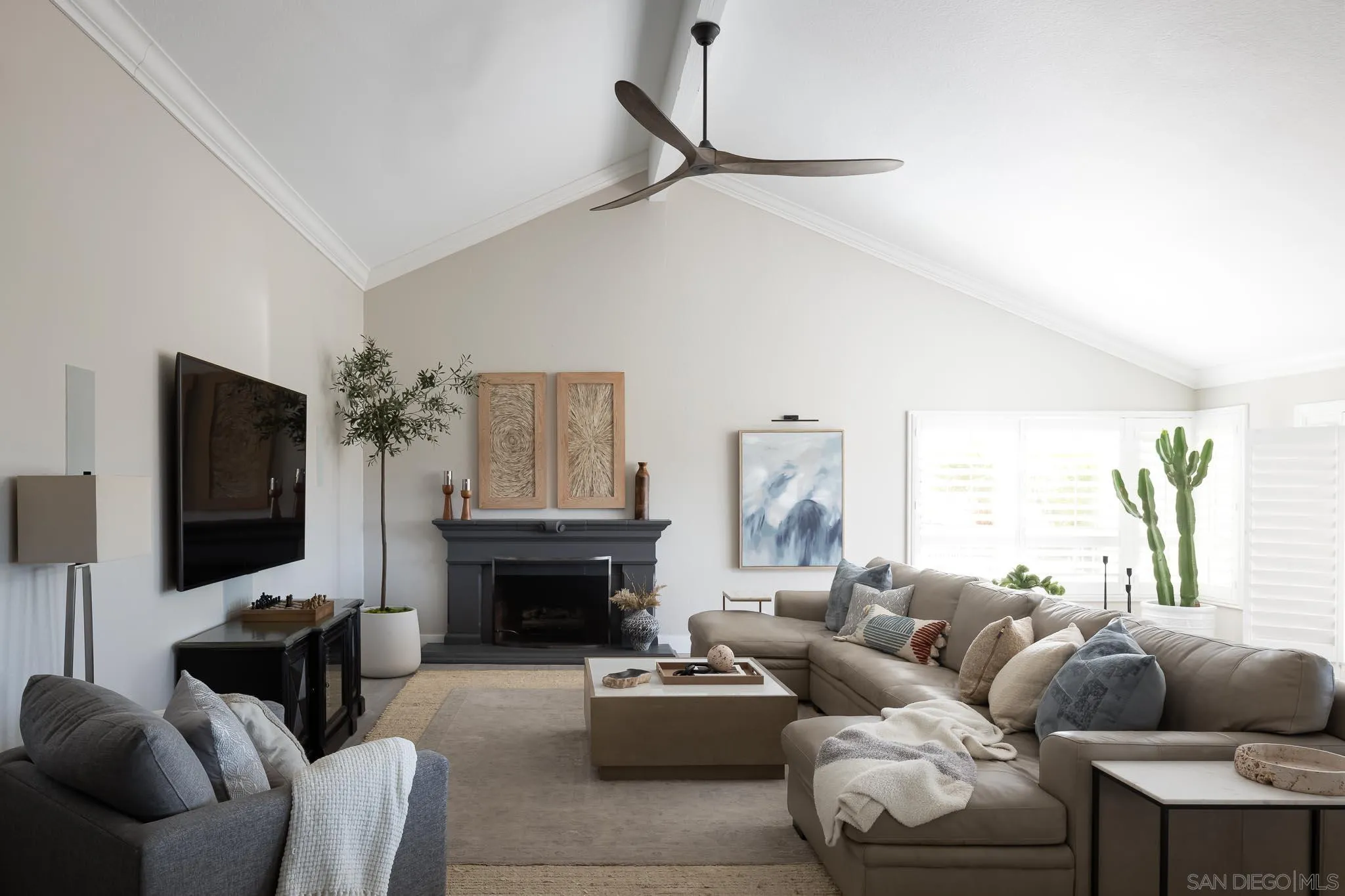 12645 Treehill Place Poway, CA 92064 - Photo 15 of 52 a living room with furniture a flat screen tv and a fireplace
