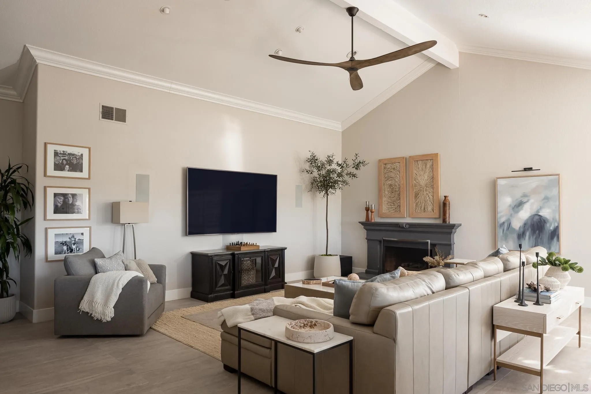 12645 Treehill Place Poway, CA 92064 - Photo 16 of 52 a living room with furniture a flat screen tv and a fireplace