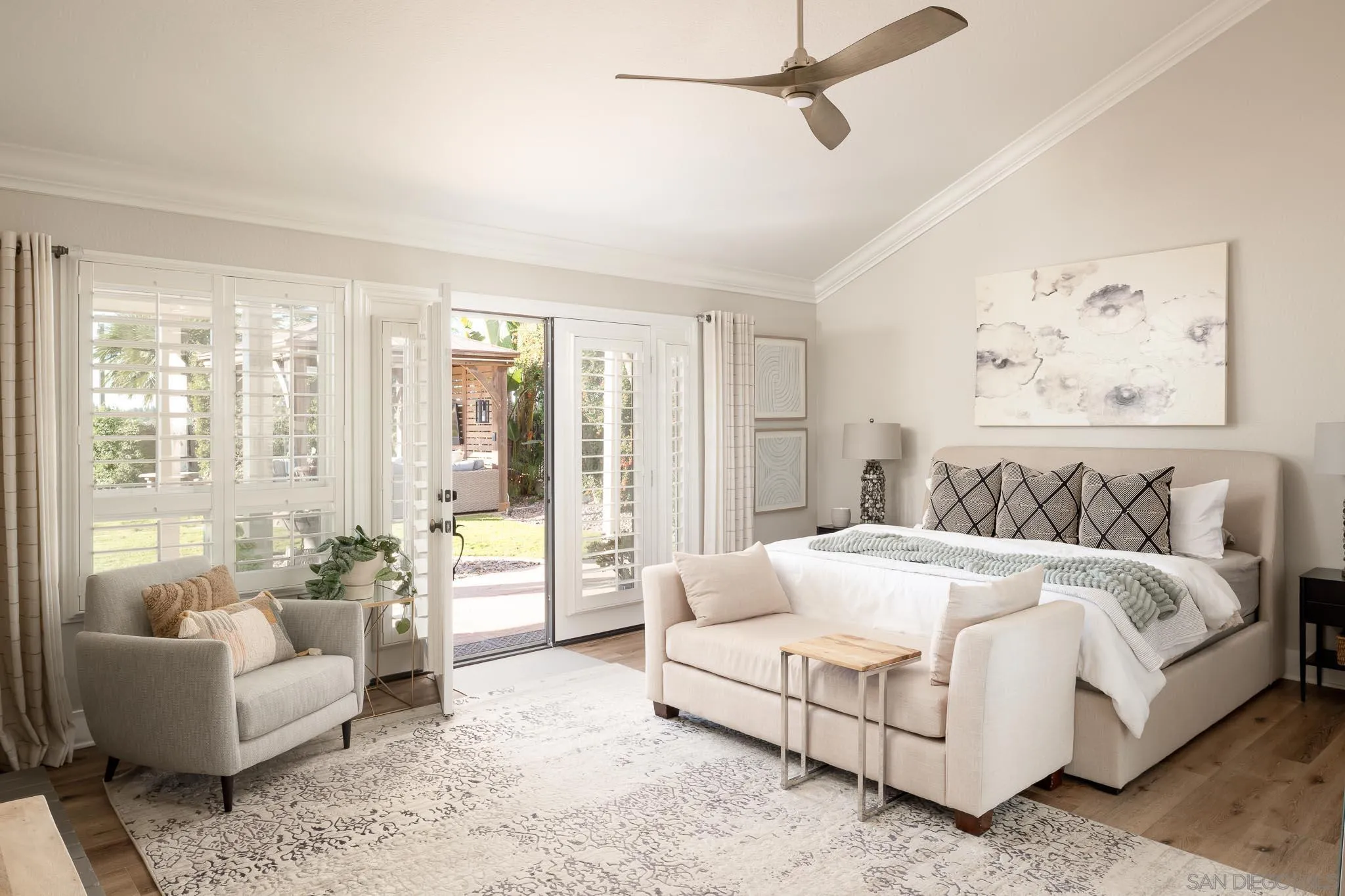 12645 Treehill Place Poway, CA 92064 - Photo 20 of 52 a spacious bedroom with a bed and glass walk in closet