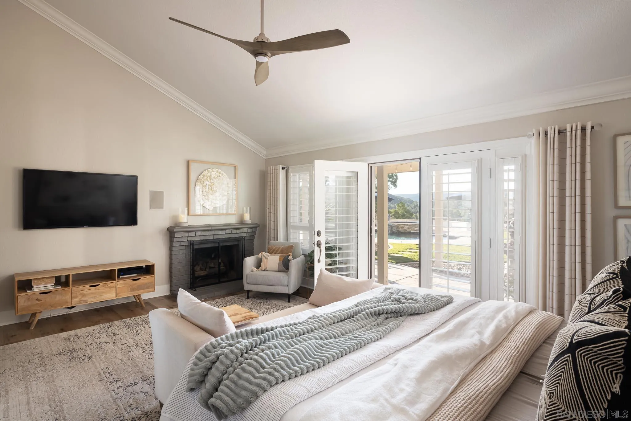 12645 Treehill Place Poway, CA 92064 - Photo 21 of 52 a spacious bedroom with a large bed a flat screen tv and a couch