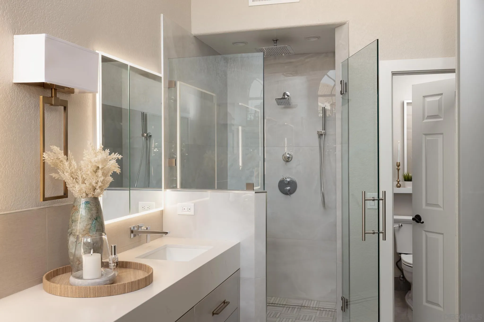 12645 Treehill Place Poway, CA 92064 - Photo 24 of 52 a bathroom with a sink and a mirror