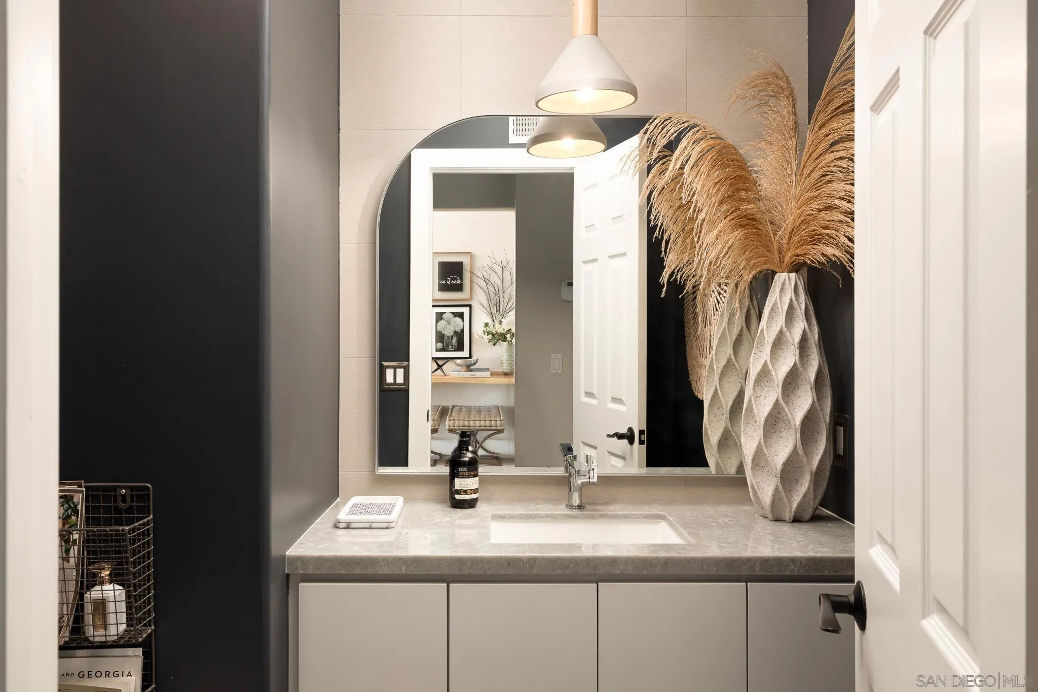 12645 Treehill Place Poway, CA 92064 - Photo 25 of 52 a bathroom with a granite countertop sink and a mirror