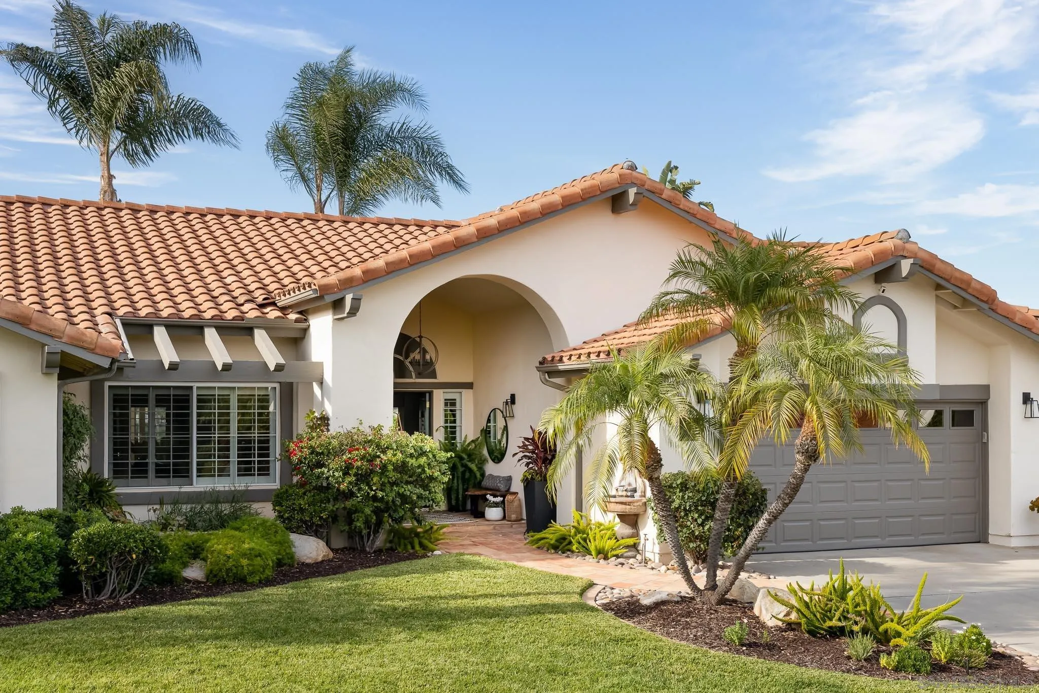 12645 Treehill Place Poway, CA 92064 - Photo 3 of 52 a front view of a house with a yard