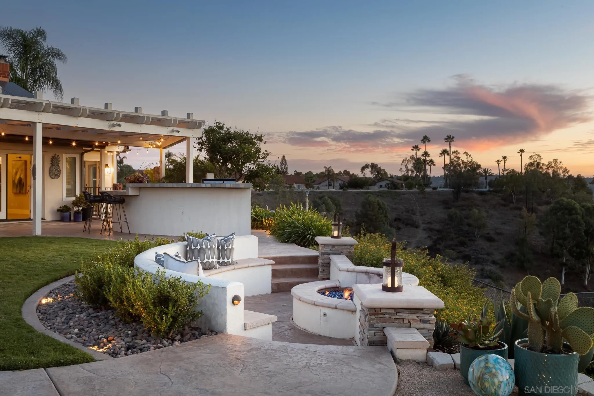 12645 Treehill Place Poway, CA 92064 - Photo 38 of 52 a view of a patio with couches table and chairs and potted plants