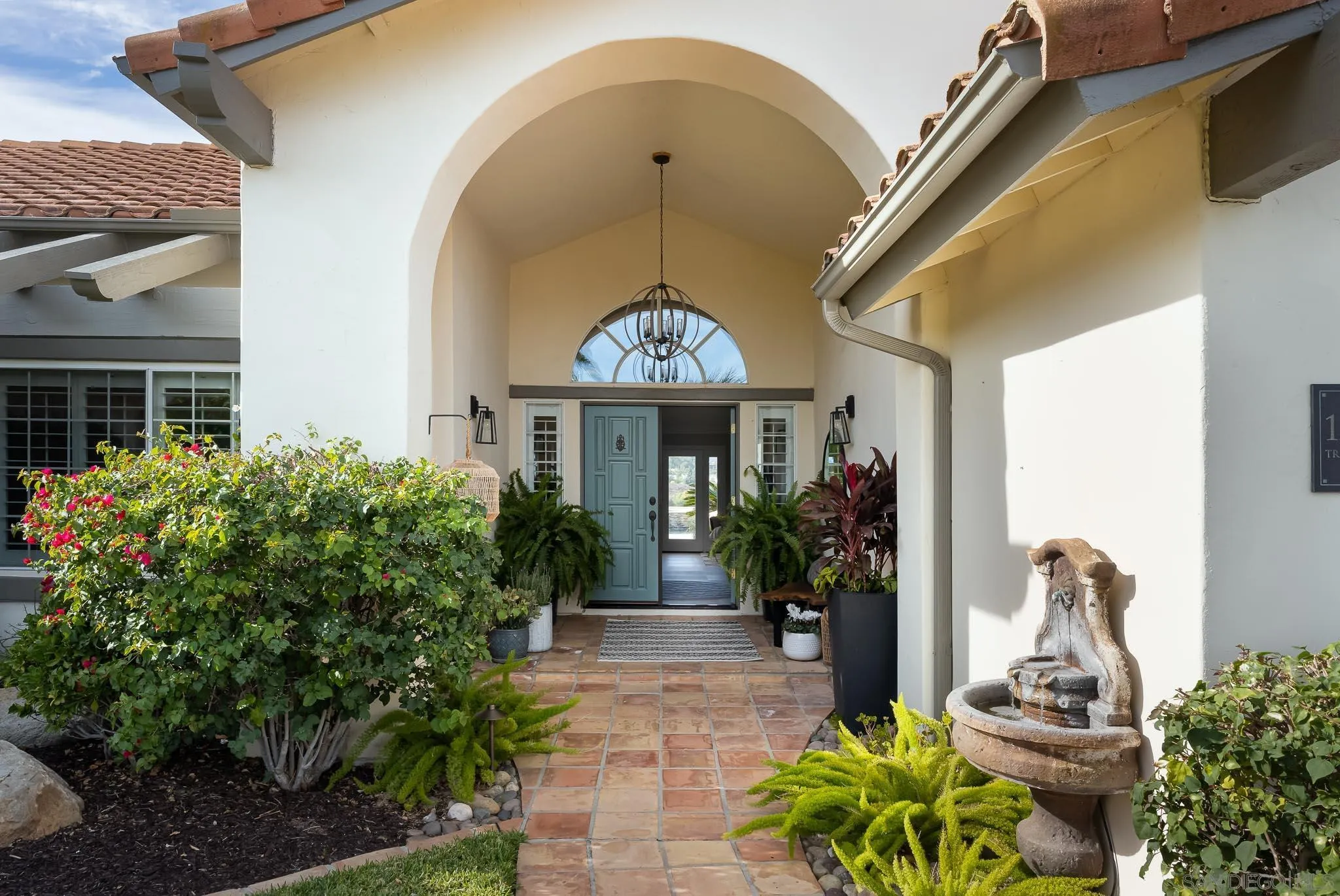 12645 Treehill Place Poway, CA 92064 - Photo 4 of 52 a front view of a house with a yard