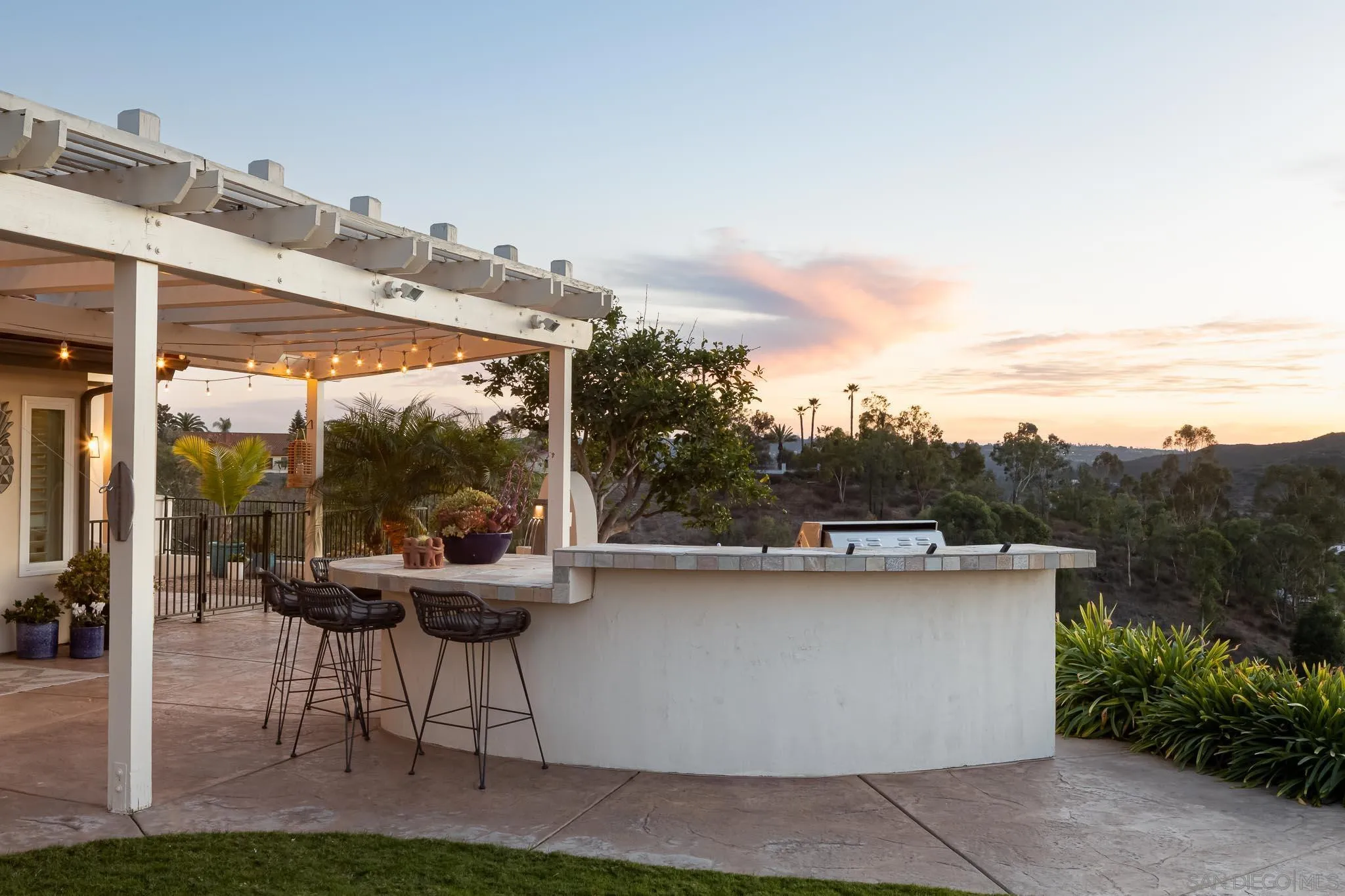 12645 Treehill Place Poway, CA 92064 - Photo 41 of 52 a view of a patio with a table and chairs