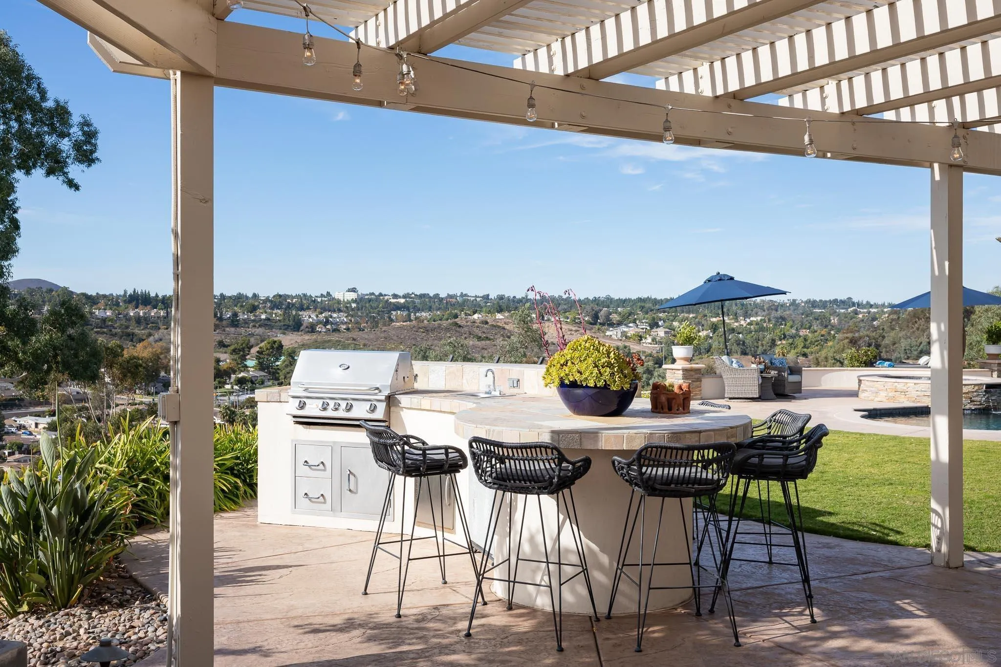 12645 Treehill Place Poway, CA 92064 - Photo 44 of 52 a view of a chairs and table in patio with a yard