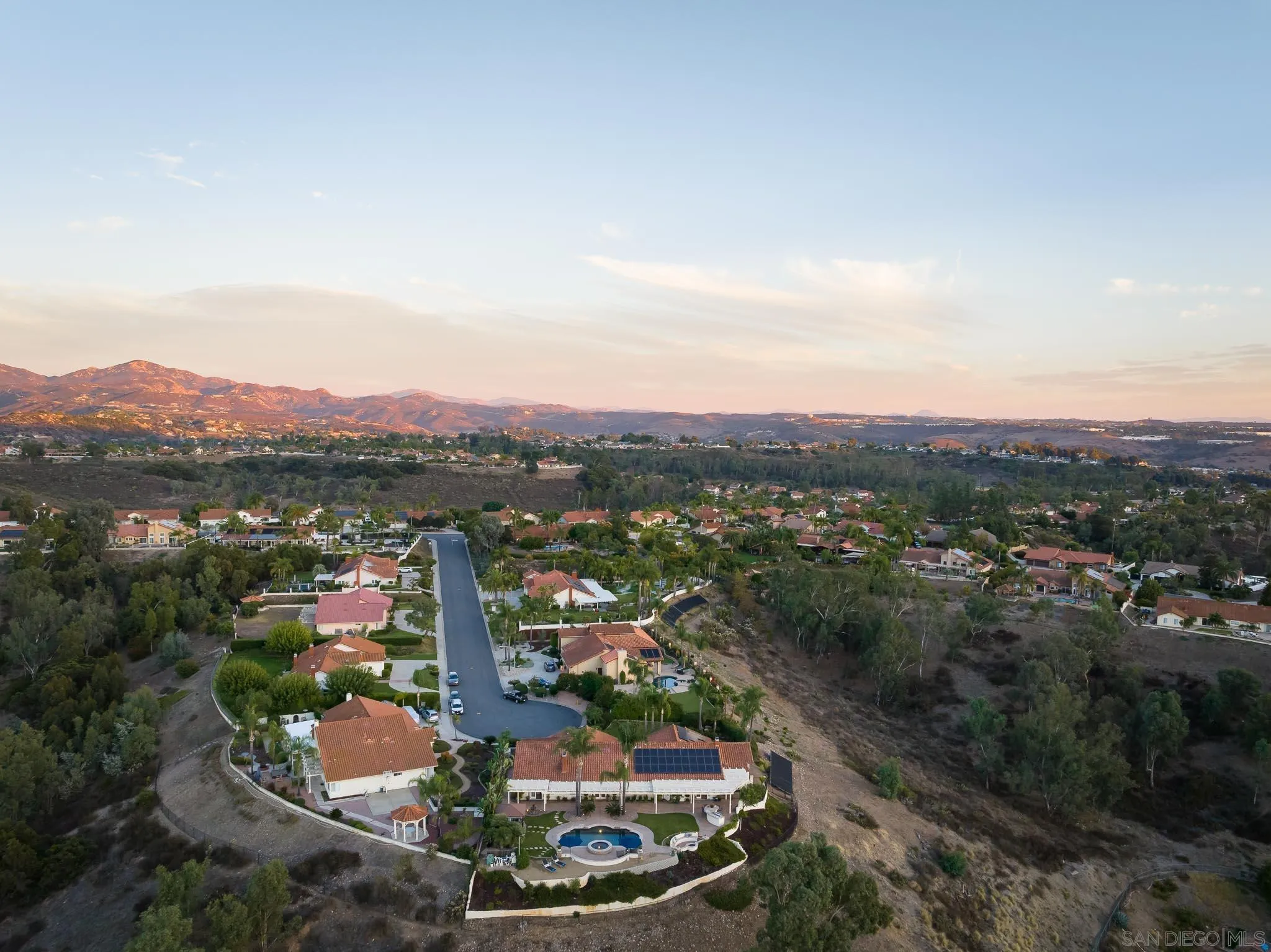 12645 Treehill Place Poway, CA 92064 - Photo 50 of 52 an aerial view of a city with lots of residential buildings ocean and mountain view in back