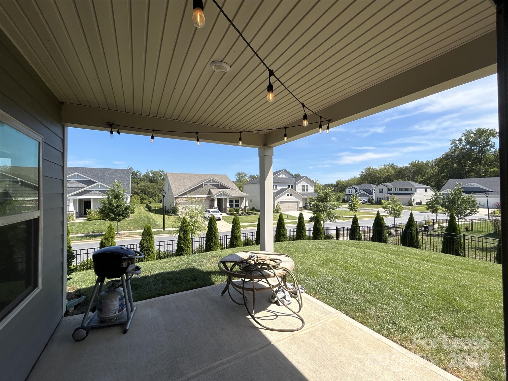 3801 Isenhour Road Kannapolis, NC 28081 - Photo 15 of 16 a view of a patio with table and chairs potted plants with wooden floor