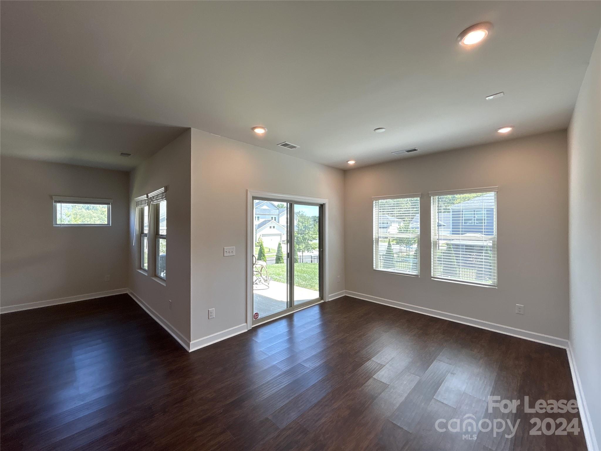 3801 Isenhour Road Kannapolis, NC 28081 - Photo 7 of 16 a view of an empty room with wooden floor and a window