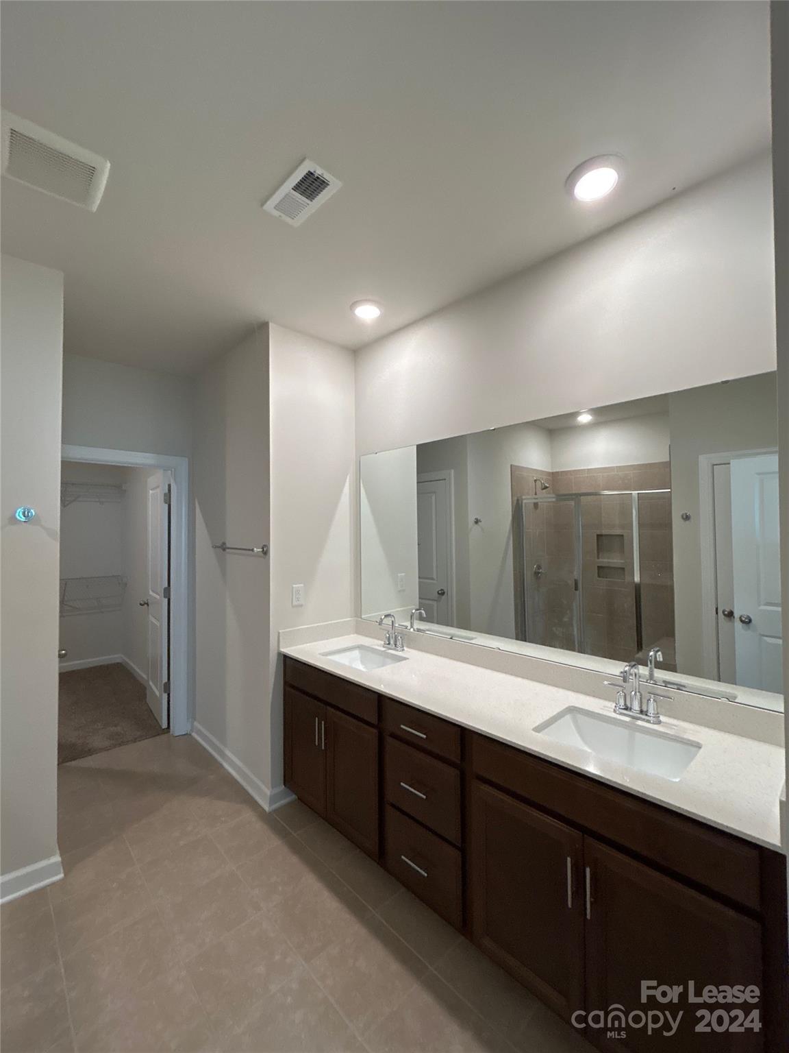 3801 Isenhour Road Kannapolis, NC 28081 - Photo 9 of 16 a bathroom with a double vanity sink and a mirror