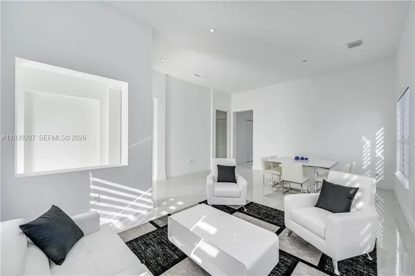 a living room with couches and a table