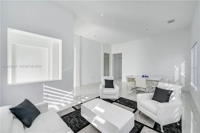 a living room with couches and a table