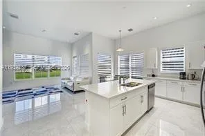 a very nice looking kitchen with a large window