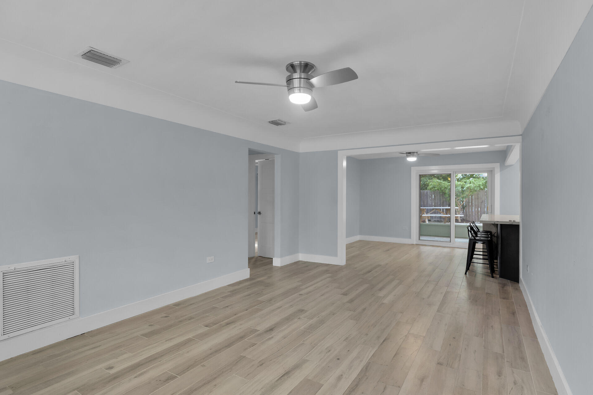 535 Plante Street Key Largo, FL 33037 - Photo 12 of 47 wooden floor in an empty room with a window