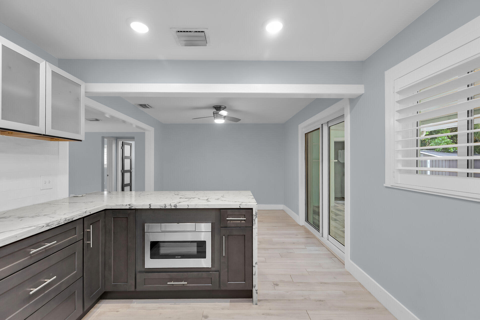535 Plante Street Key Largo, FL 33037 - Photo 19 of 47 a kitchen with granite countertop a stove two sinks a refrigerator and a window