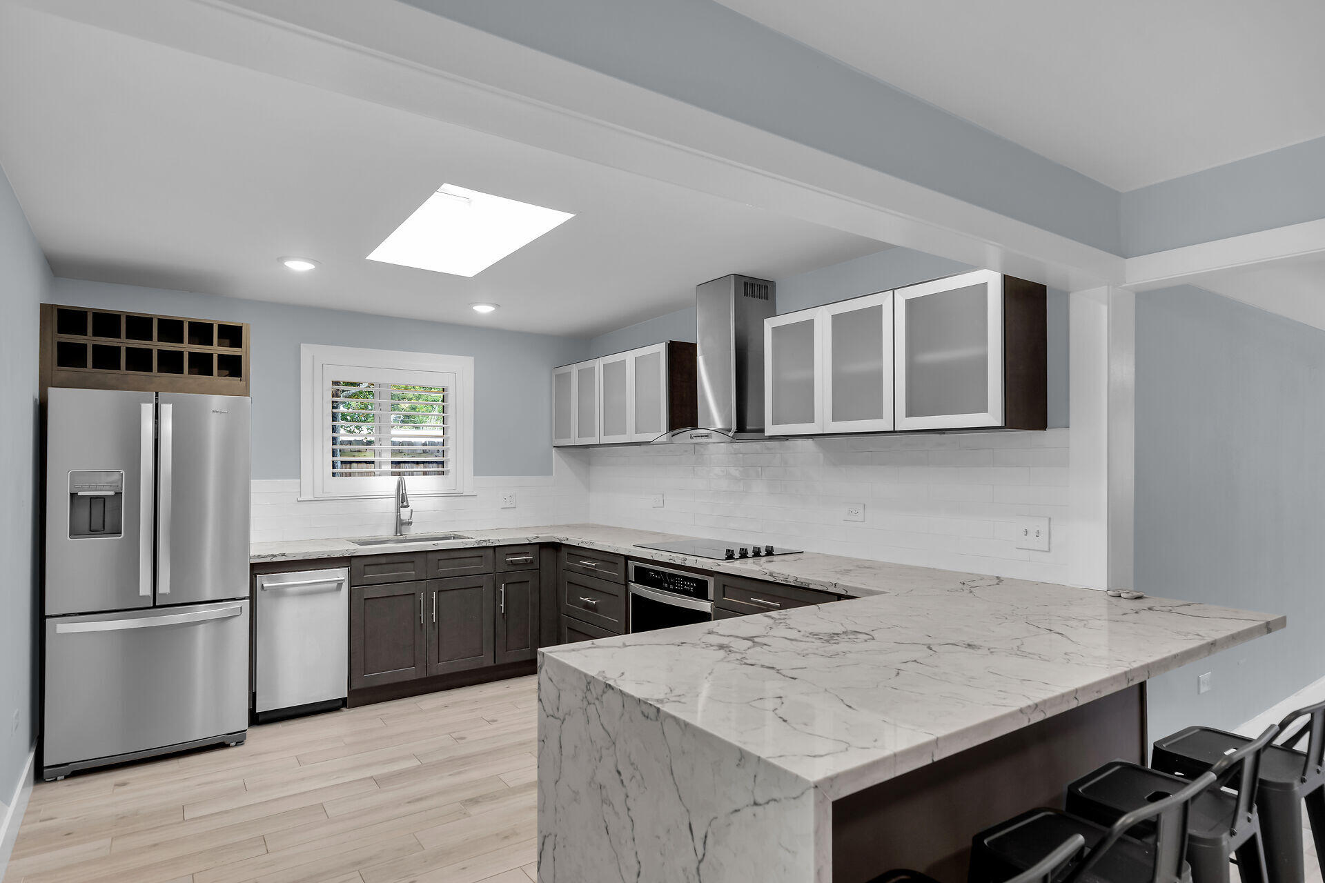 535 Plante Street Key Largo, FL 33037 - Photo 3 of 47 a kitchen with a sink a stove and refrigerator