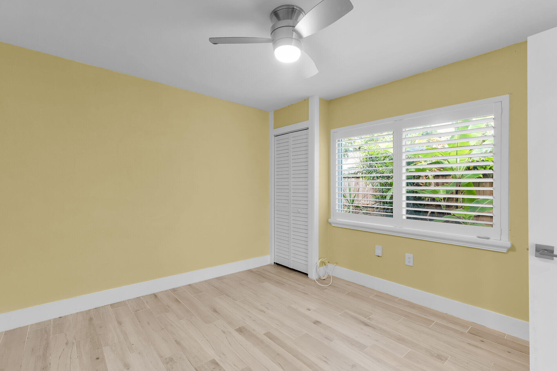 535 Plante Street Key Largo, FL 33037 - Photo 32 of 47 a view of empty room with wooden floor and fan