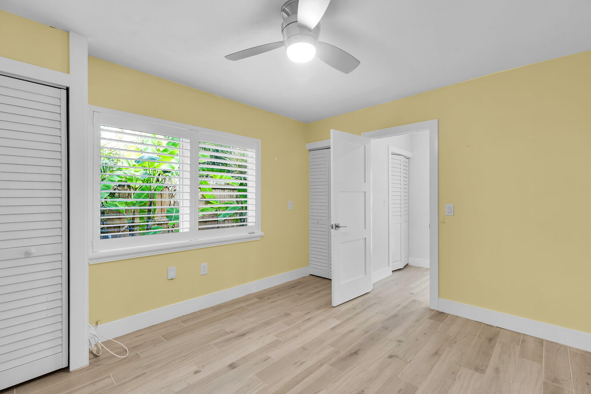 535 Plante Street Key Largo, FL 33037 - Photo 33 of 47 a view of an empty room with wooden floor and a window