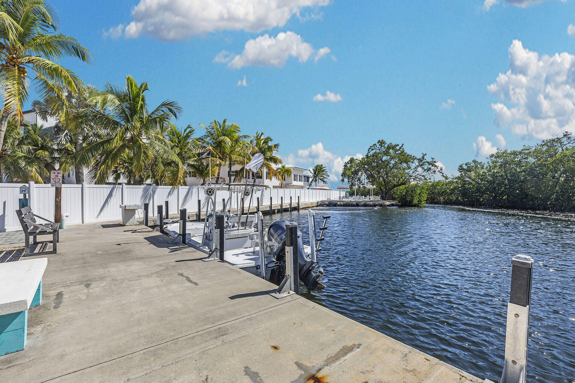 535 Plante Street Key Largo, FL 33037 - Photo 41 of 47 a view of a swimming pool with a patio and a yard