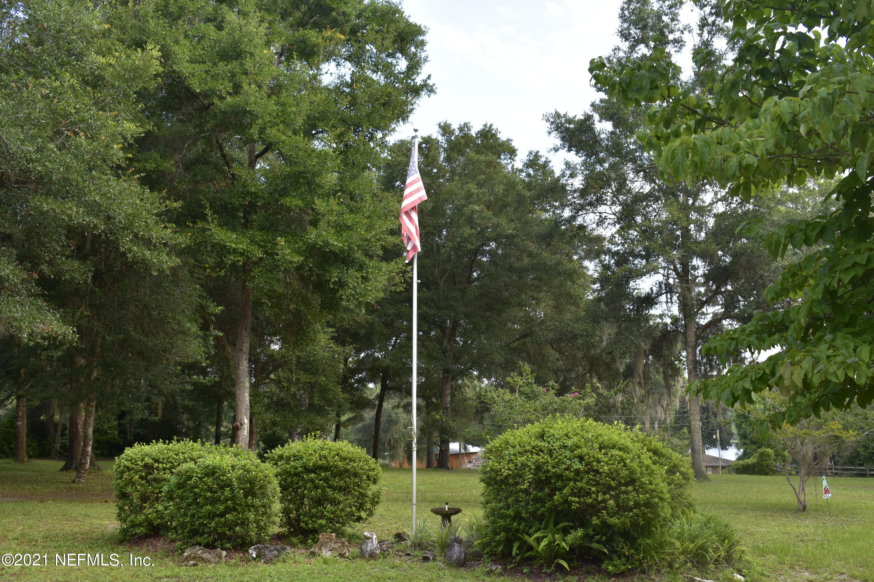 a flag is sitting in the middle of a park