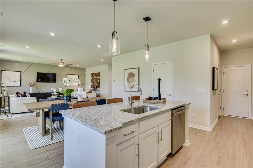 325 Cavalier Lane Acworth, GA 30102 - Photo 12 of 61 a view of living room kitchen island stainless steel appliances wooden floor and living room view