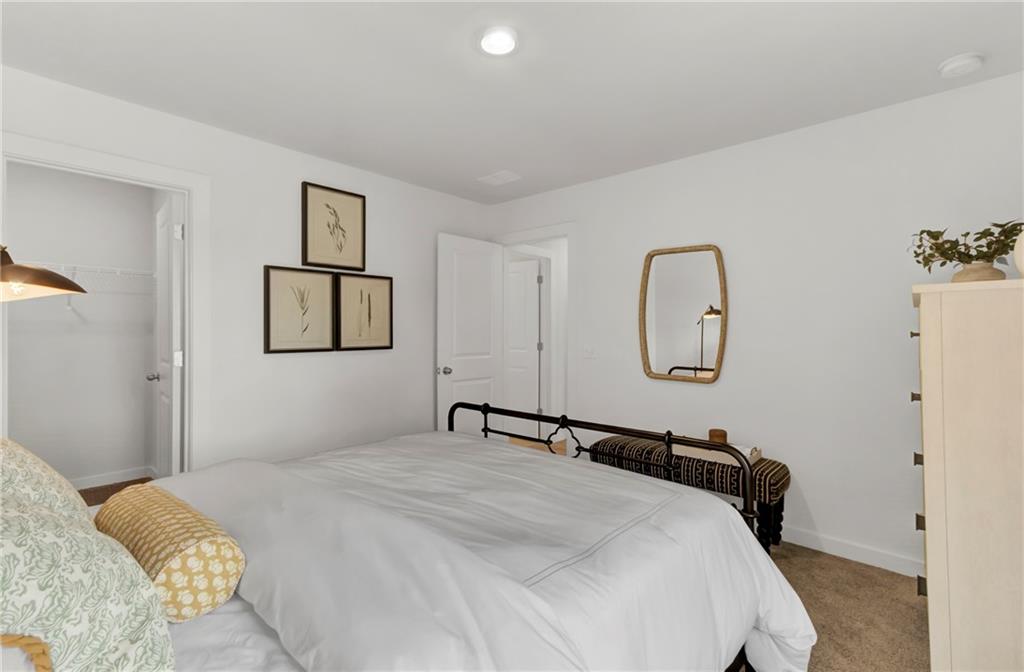 325 Cavalier Lane Acworth, GA 30102 - Photo 19 of 61 a bedroom with a bed and a mirror