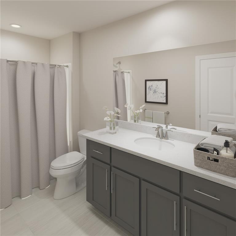 325 Cavalier Lane Acworth, GA 30102 - Photo 22 of 61 a bathroom with a toilet sink and mirror