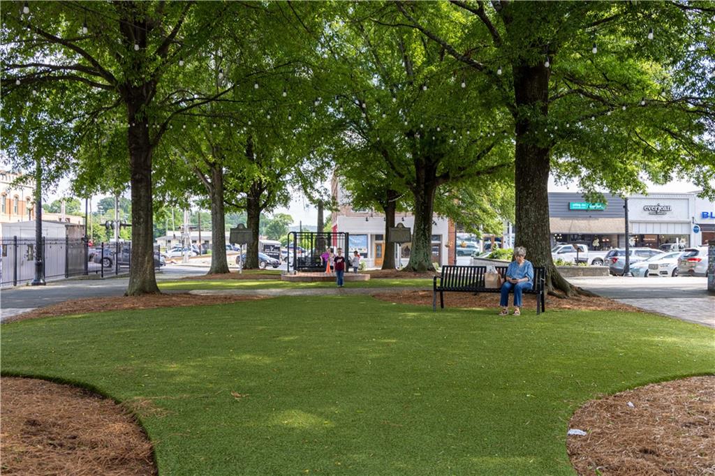 325 Cavalier Lane Acworth, GA 30102 - Photo 51 of 61 a view of a park with bench and a large tree